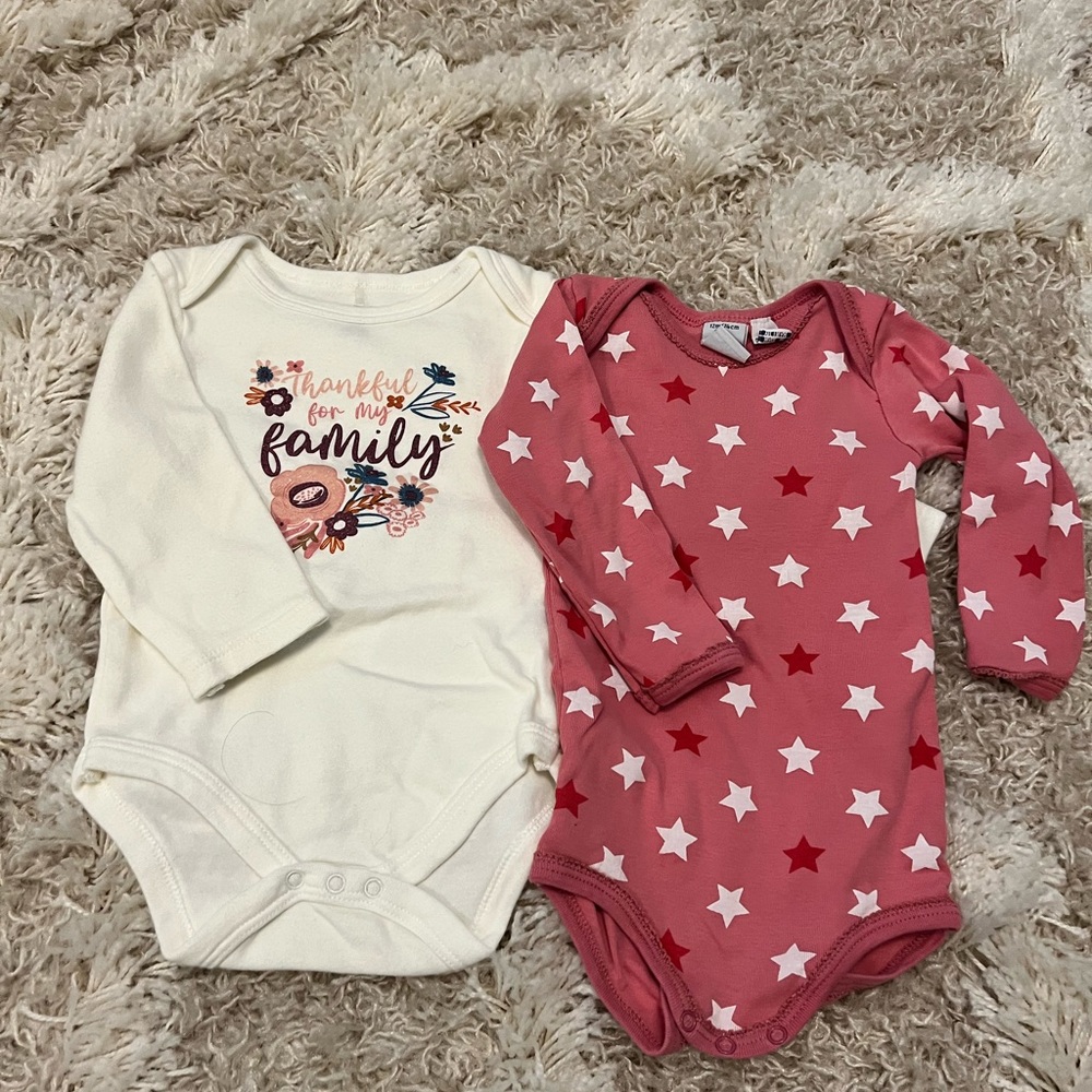 2 long sleeved girls onesies.